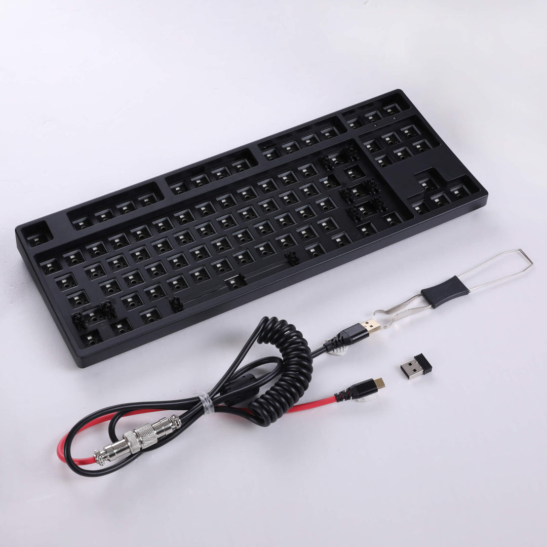 Black barebones keyboard featuring 87 keys, providing a sleek and compact typing solution with essential functionality.