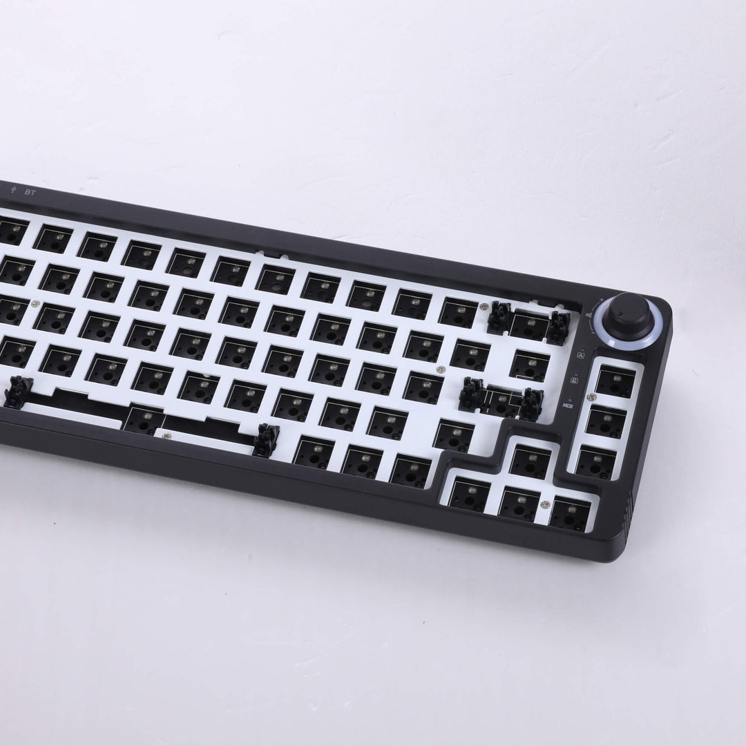 Black barebones keyboard with 67 switches and a versatile adjustable knob, offering a minimalist and functional design for customized typing and control.