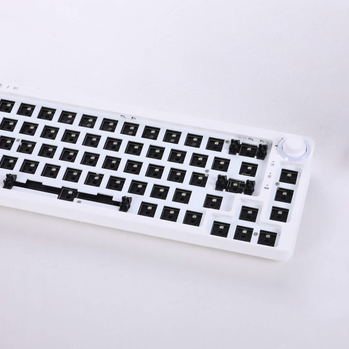 White barebones keyboard with 67 switches and a versatile adjustable knob, offering a minimalist and functional design for customized typing and control.