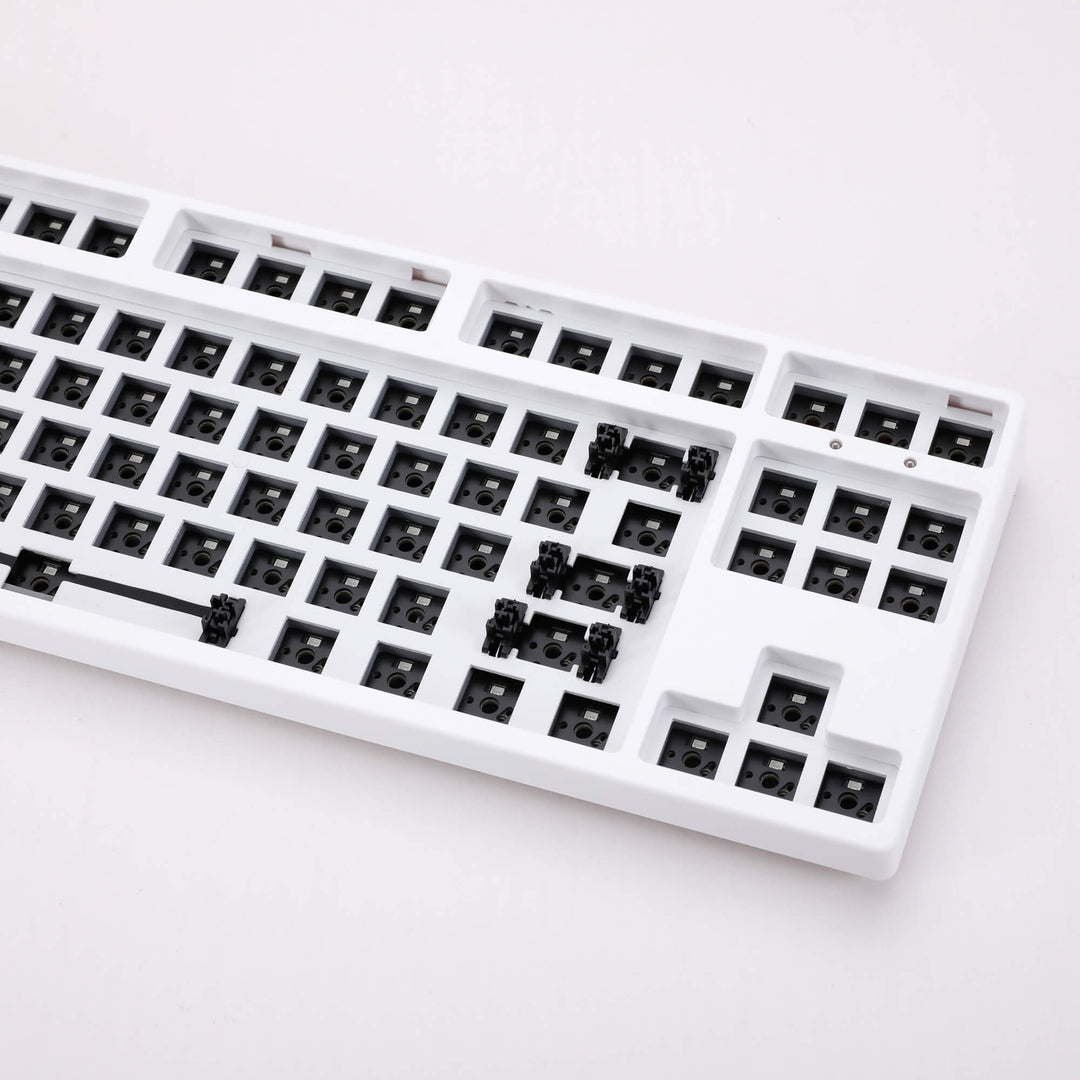 White barebones keyboard featuring 87 keys, providing a sleek and compact typing solution with essential functionality.