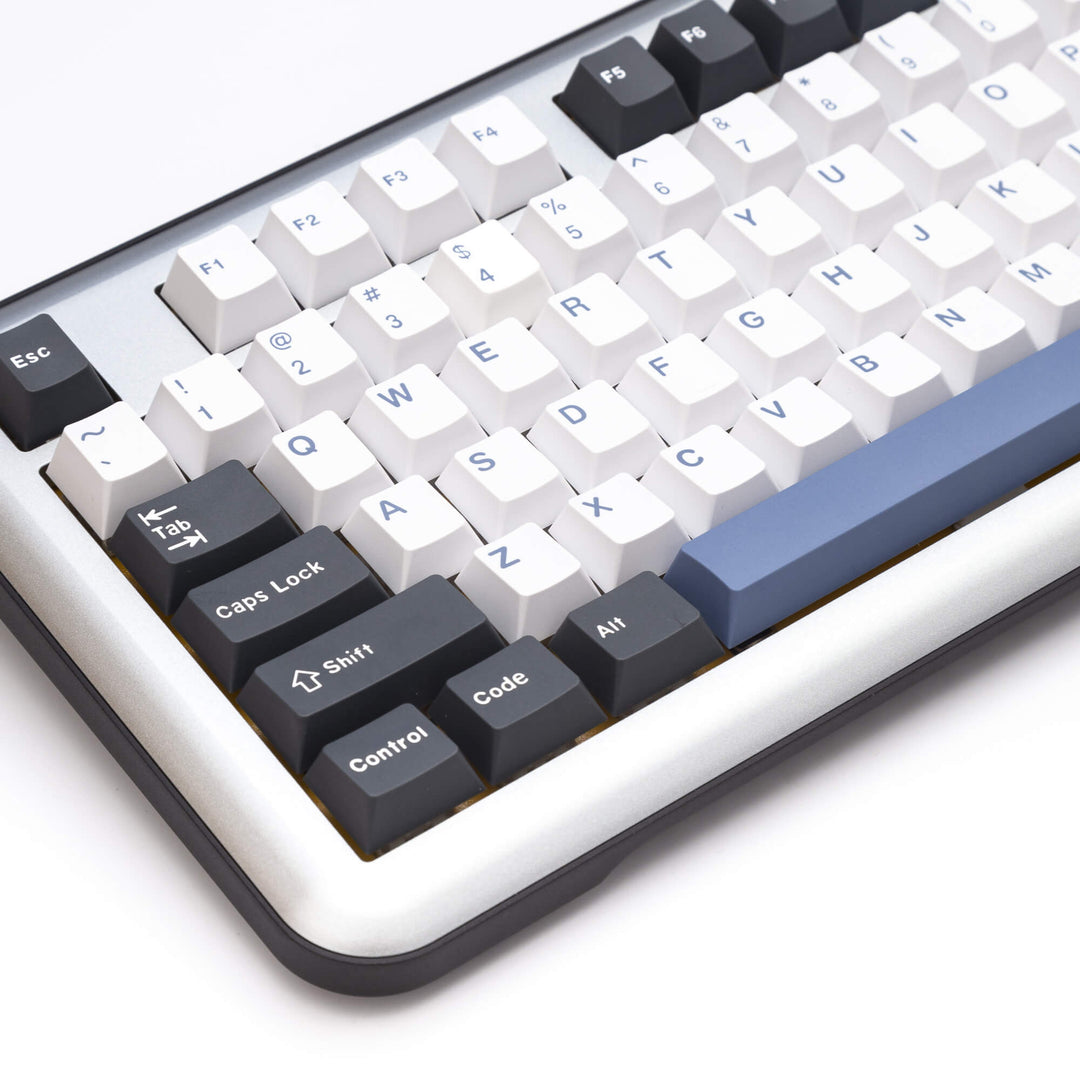 Arctic custom keycap set enhancing a keyboard, with frosty white and icy blue keycaps, creating a cool and refreshing visual theme for your typing setup.