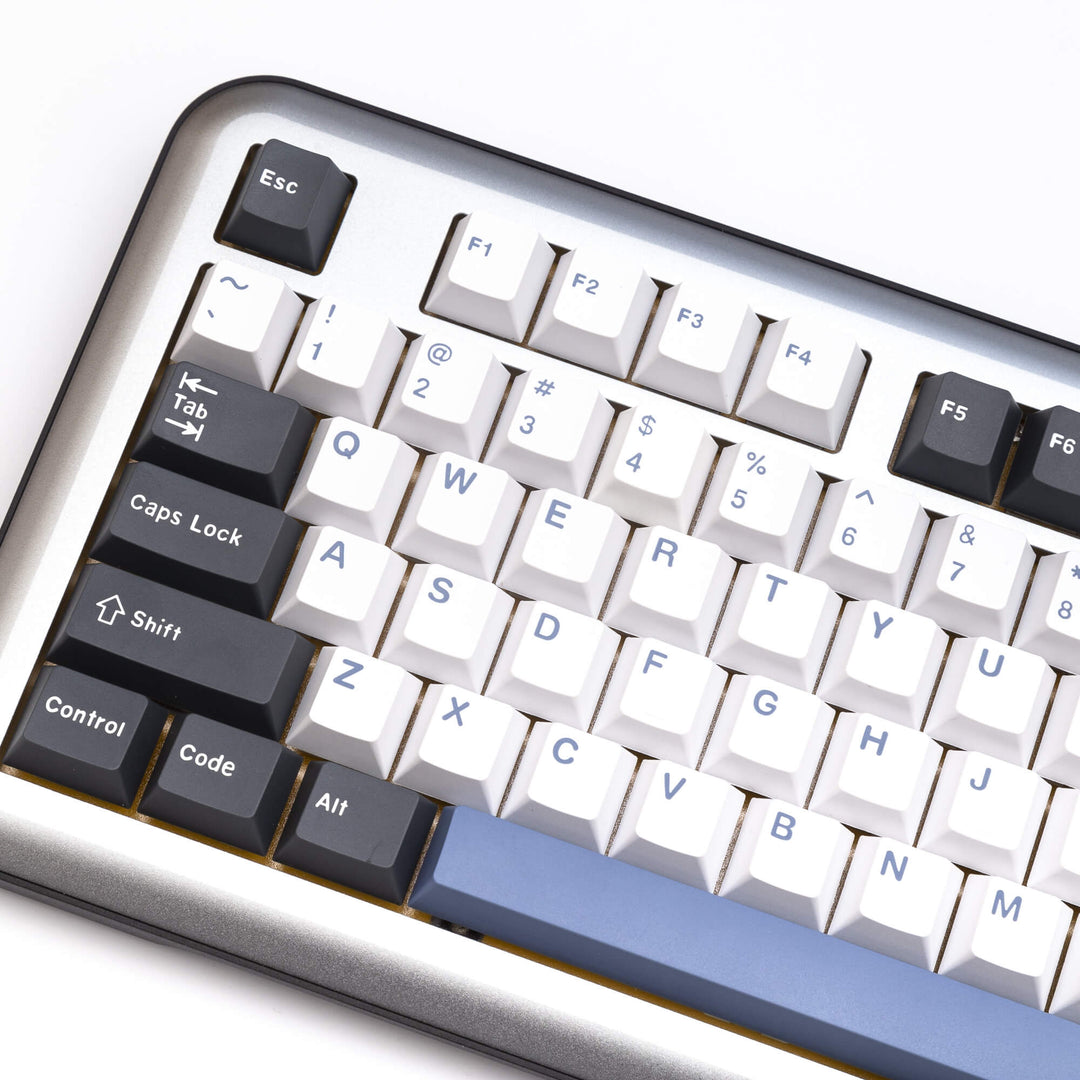 Arctic custom keycap set enhancing a keyboard, with frosty white and icy blue keycaps, creating a cool and refreshing visual theme for your typing setup.