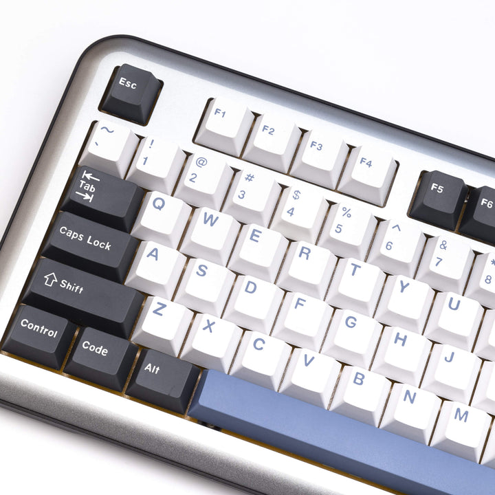 Arctic custom keycap set enhancing a keyboard, with frosty white and icy blue keycaps, creating a cool and refreshing visual theme for your typing setup.