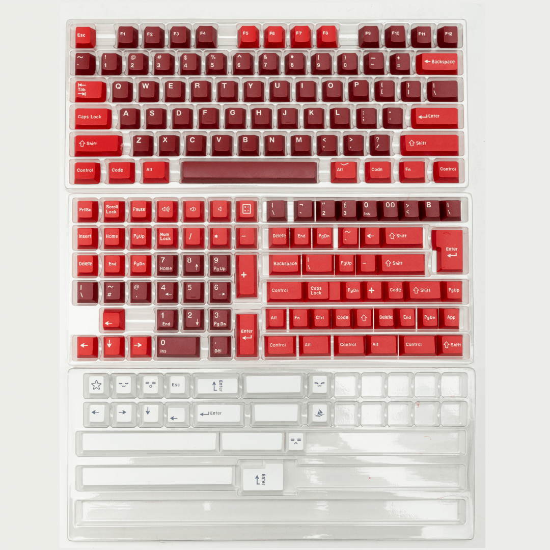 Jamon keycap set shown in its packaging featuring a range of rich red hues, adding a tasteful and vibrant accent to your keyboard.