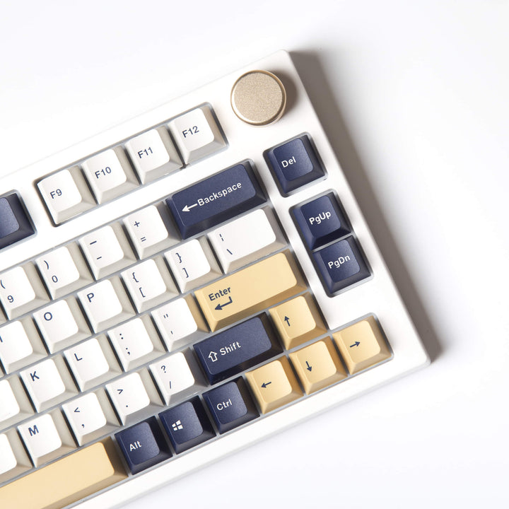 Rudy keycap set, featuring a joyful and vibrant design with a palette of navy blue and gold colors, combined with intricate details for an engaging and stylish look on your keyboard.