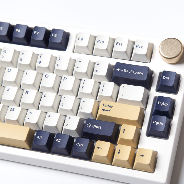 Rudy keycap set, featuring a joyful and vibrant design with a palette of navy blue and gold colors, combined with intricate details for an engaging and stylish look on your keyboard.