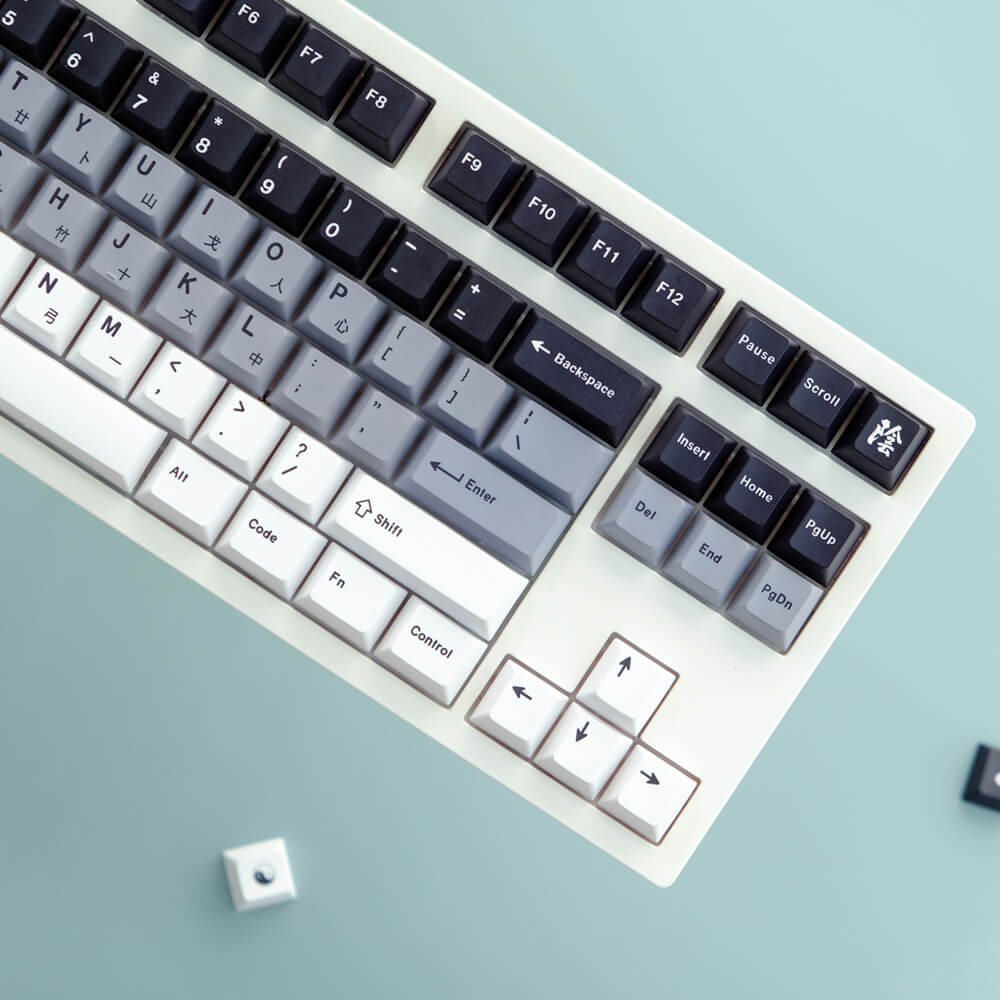 Yin and Yang keycap set, designed with a balanced combination of PBT keycaps in a soothing yin/yang motif, featuring a classic cherry profile for a harmonious and distinctive look on your keyboard.